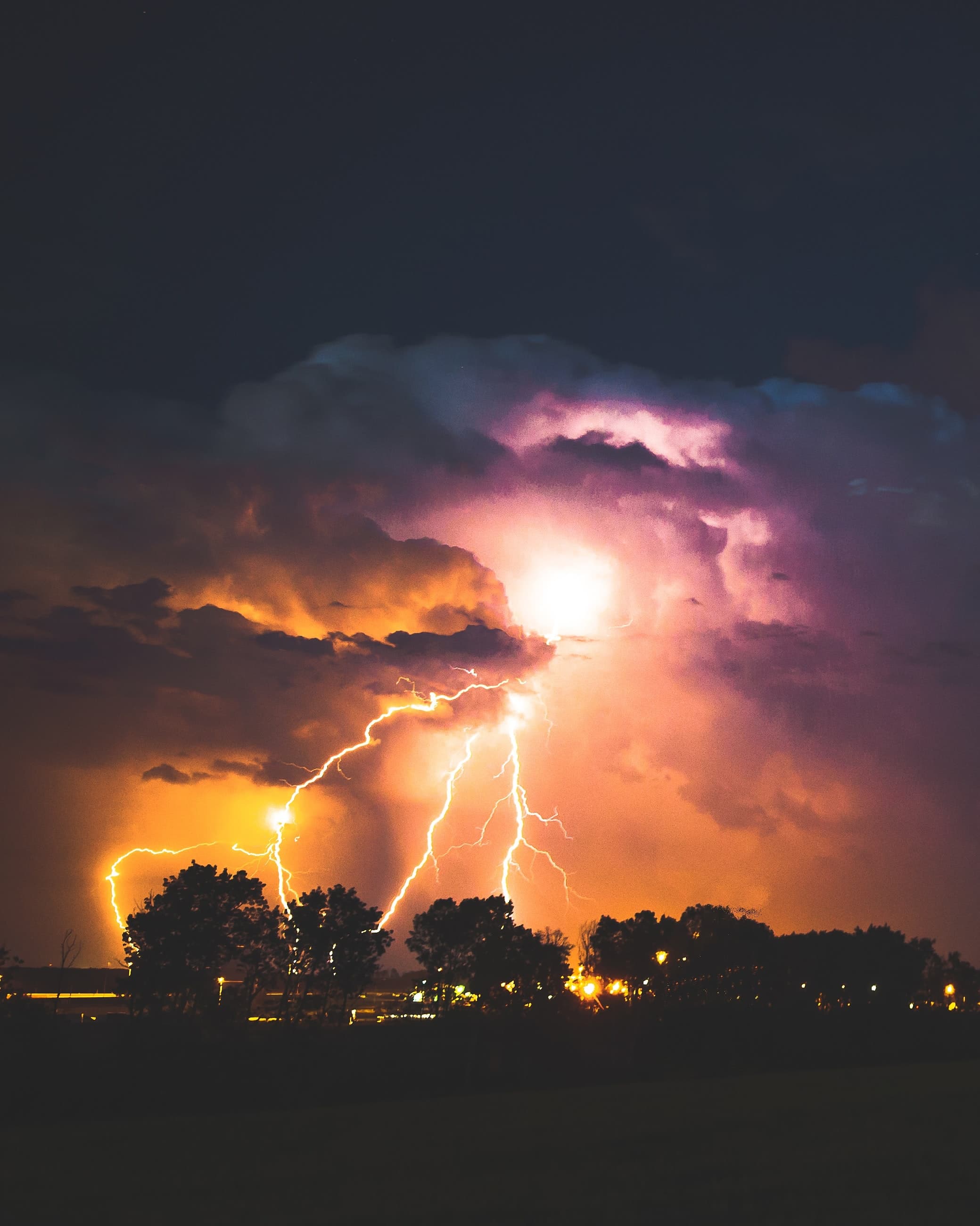 Thunderstorm with lightening in purple sky